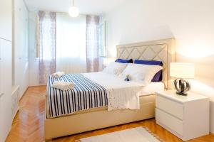 Posteľ alebo postele v izbe v ubytovaní Apartment Mandalina