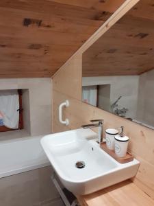 a bathroom with a sink and a mirror at Baita Amiata in Monte Amiata +20 photos