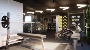 a gym with a bench and a weight machine at Empire Hotel Buenos Aires in Buenos Aires