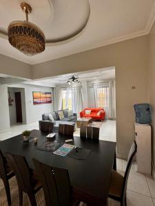 a living room with a table and a couch at Ocean breeze apartment in Mombasa