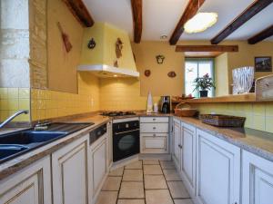 a kitchen with a sink and a dishwasher at Peaceful Stay in Thédirac in Lavercantière