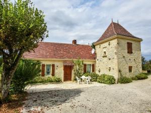 an old stone house with a table in front of it at Peaceful Stay in Thédirac in Lavercantière +32 photos