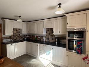 Køkken eller tekøkken på Mary Cottage