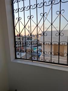 a window with a view of a city at Studio Apartment Naivas Mwembe tayari Cbd in Mombasa