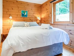 Ένα ή περισσότερα κρεβάτια σε δωμάτιο στο Tunturi - Cottage