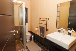 a bathroom with a sink and a shower at Heathercreek Accommodation in George +24 photos