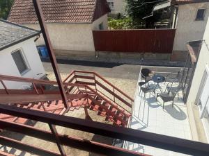 an overhead view of a patio with two chairs and a table at Réz Family Apartmanok Gyula in Gyula