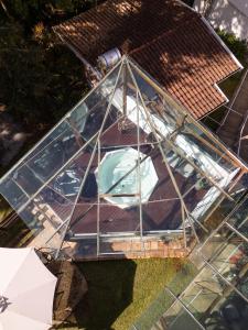 an overhead view of a house with a glass roof at Pousada Apple House Campos do Jordao in Campos do Jordão