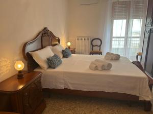 Un pat sau paturi într-o cameră la Dimora Peppino