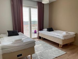 Ένα ή περισσότερα κρεβάτια σε δωμάτιο στο Kotimaailma - Cosy 3BR apartment for 5