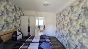 a bedroom with a bed with blue pillows on it at Ferienwohnung Blumenberg Hahn Grabenstraße in Staßfurt