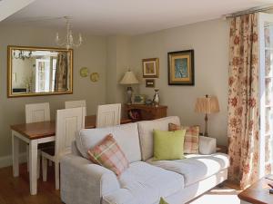a living room with a couch and a table at Rosie's Retreat in Whitby
