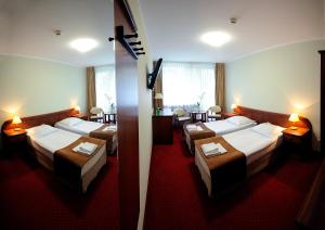Posteľ alebo postele v izbe v ubytovaní Hotel Zawisza