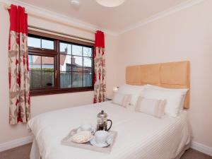 En eller flere senge i et værelse på Cleets Retreat + 15 billeder