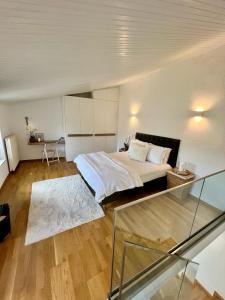 a bedroom with a bed and a glass table at Saint George Cottage in Avyenikí