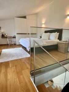 a bedroom with a bed and a glass table at Saint George Cottage in Avyenikí +7 photos