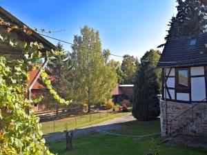 a view of a yard with a house at Geräumiges Ferienhaus in Hessen mit Garten in Waldeck +31 photos