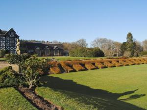 a shadow of a person walking in a garden at Church Lane in Llanidloes