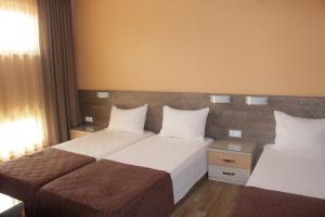 Кровать или кровати в номере Guest House Rositsa