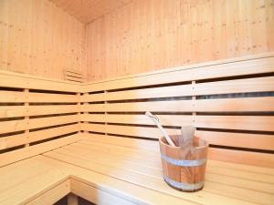 a wooden sauna with a wooden utensil in it at Wohnung in Lohberg nahe Arber Skipisten in Schwarzenbach