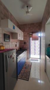 Η κουζίνα ή μικρή κουζίνα στο 2bhk Misty Retreat Villa