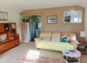 a living room with a couch and a table at Catbells Sunrise Cottage Borrowdale Lake District in Keswick
