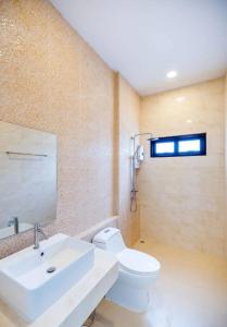 a bathroom with a white sink and a toilet at Villa 3 Bedrooms in Central Hua Hin Near Beach in Hua Hin