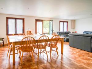 a living room with a table and chairs at Halfway between near Nature Park in Jalhay