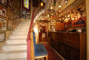 a stairway in a pub with a staircase and a bar at Kybele Hotel in Istanbul