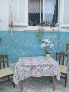 a table and two chairs and a window at Alanis in Vela Luka