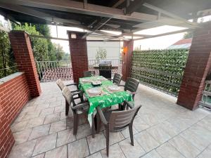 a patio with a table and chairs on a patio at La casa del sole in Valfenera +29 photos