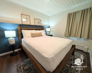 a bedroom with a bed and a window at Beachfront Haven in Detroit Lakes