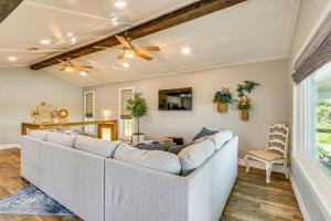 a living room with a couch and a table at Bayfront Milton Retreat with Dock and Game Room in Milton