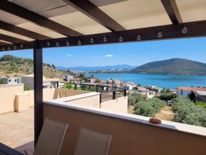 a balcony with a view of the water at Lovely house with amazing views in Chalkida