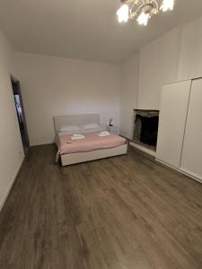 a bedroom with a bed and a fireplace at Molino in Pavia