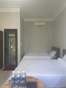Ένα ή περισσότερα κρεβάτια σε δωμάτιο στο Homestay Nam Anh