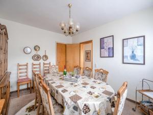 a dining room with a table and chairs at Geräumiges Apartment am Waldrand im Sauerland in Medebach +32 photos