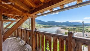 a cabin balcony with a view of the mountains at Maison de village Puyvalador in Puyvalador