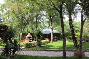 a park with a gazebo in the grass at Apartments in Fiorini - Istrien 11997 in Fiorini