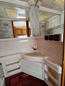a bathroom with a sink and a mirror at Farma na Lazoch in Slatinské Lazy