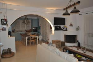 a living room with a couch and a table at Fairytale View in Karistos