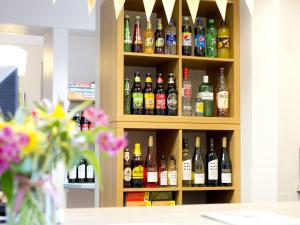 a cabinet filled with lots of bottles of alcohol at YHA Hawkshead in Hawkshead