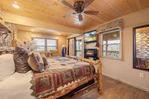 a bedroom with a bed and a ceiling fan at Dolly Bear by American Patriot Getaways in Shady Grove