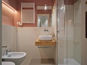 a bathroom with a sink and a shower at Antico Palazzo Giugni - Adults Only - in Florence