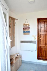 a room with a door and a sign on the wall at Stone House - Virak in Žabljak +29 photos