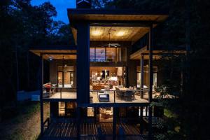 a house with a view of a living room at Greenridge- Upscale Architecture and Modern Design in Blue Ridge