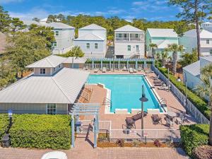 an aerial view of a swimming pool and a house at Steps to Pool & Beach on Magical in Santa Rosa Beach