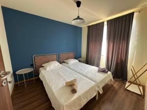 En eller flere senge i et værelse på Petra e Mare