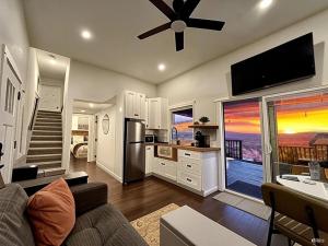 a living room with a couch and a kitchen at The Ultimate View - Private Spa & Fireplace in Temecula