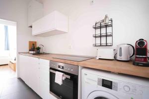 Kuchyň nebo kuchyňský kout v ubytování Modern living in city center - fully equipped + 5 fotografií